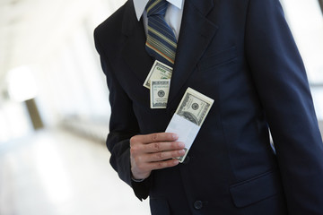money in the pocket of a businessman