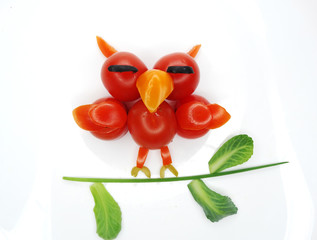 creative funny vegetable snack with tomato