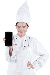 Chef showing smartphone in the studio