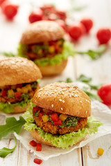 Vegetarian burger with organic products, lettuce, herb pesto and peppers