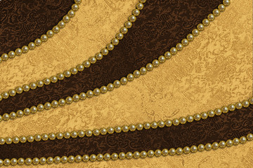abstract background with a gold and  brown satin fabric and pearls