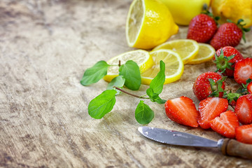 Detox  fruit infused water - ingredients on wooden table