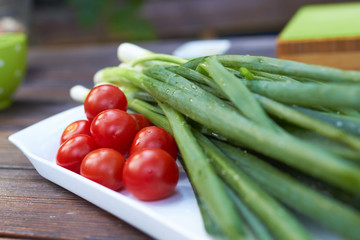 cherry tomatoes and green onions