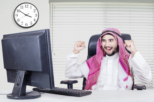 Successful middle eastern worker in office