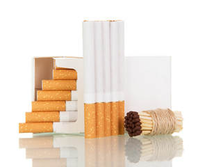 Open pack cigarettes and bunch of matches close up isolated on white