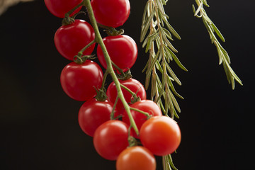 cherry tomatoes on a black background