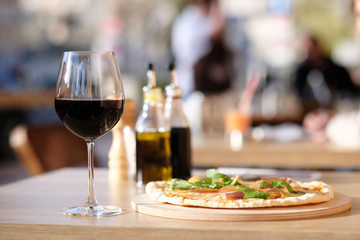 Pizza and red wine in restaurant