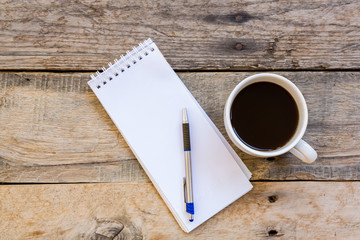cup of coffee  with paper note on wood table background
