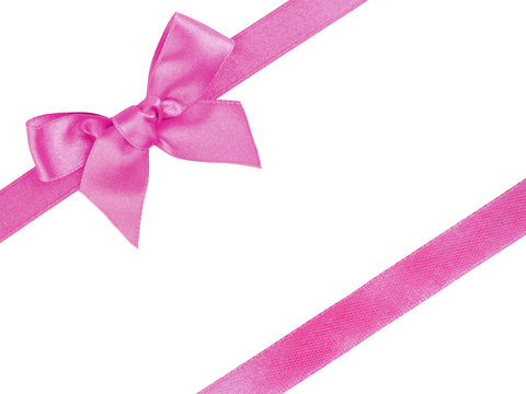 Pink diagonal ribbons and bow, isolated on white
