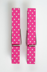 Two Pink Clothes Pins with Fun Patterns Top View