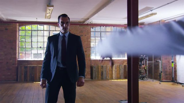  Handsome businessman or special agent character outnumbered in a fight 