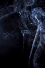 White smoke on a black background.