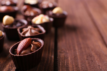 Chocolate sweets on wooden background