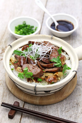 chinese sausage and chicken with rice in clay pot, cantonese food