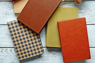 Pile of books on wooden background