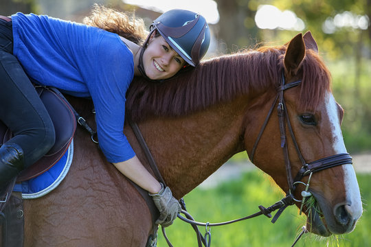 girl hugging horse - Powered by Adobe