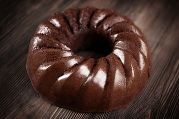Chocolate cake on brown wooden background