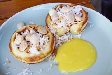 Tropical waffles with coconut and lilikoi passion fruit curd