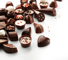 Assorted chocolate candies, isolated on white