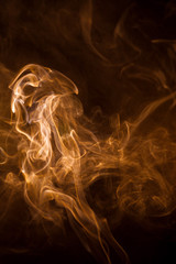 Orange smoke on a black background.