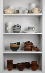 Obraz na płótnie Canvas Dishes in cupboard in the kitchen