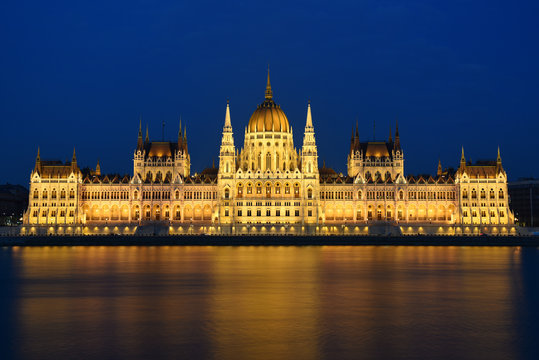 Budapest Parliament in Hungary at night on the Danube river