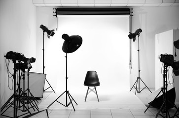 Empty photo studio with lighting equipment