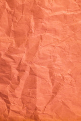 Red crumpled paper texture for background.