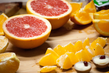 Fototapeta na wymiar Making fruit dessert from citrus fruits