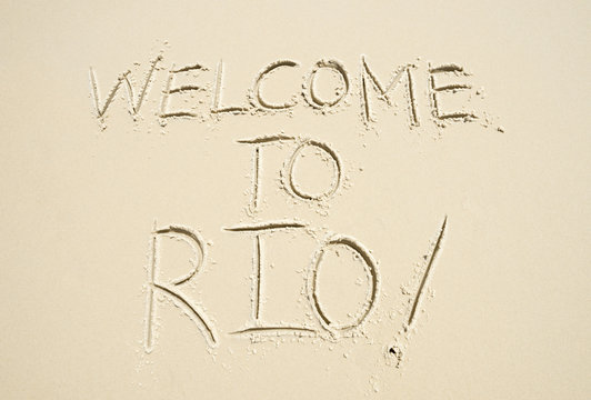 Welcome to Rio (as in, de Janeiro) message handwritten in smooth sand on the beach in Ipanema