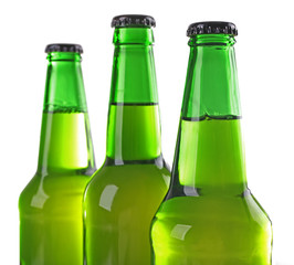 Bottles with fresh beer isolated on white