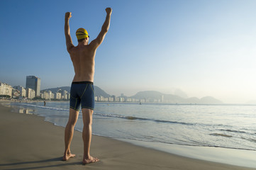 Athlete swimmer standing on Copacabana Beach in Rio de Janeiro, Brazil