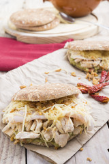 Sandwich with chickend and guacamole, cheese.