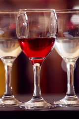 Glasses of red and white wine closeup