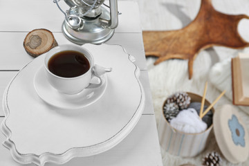 Cup of hot drink in living room. Comfortable winter weekend or holidays at home