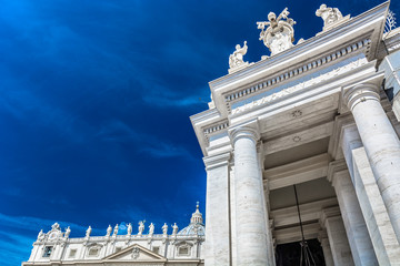 Obraz premium Facade exterior at St. Peter's square, Vatican. / Facade exterior at St. Peter's square with sculpture of saints stands above, Vatican city, Europe.