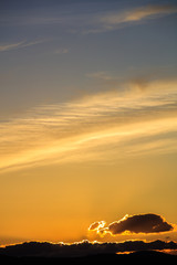 Majestic vivid sunset  over dark mountains