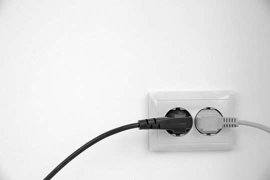 Electric plug in socket