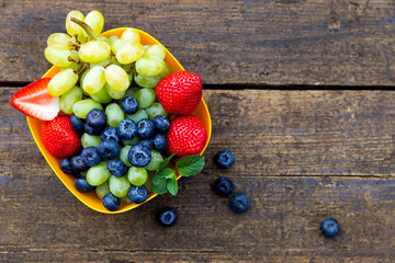 delicious fresh fruits on a wooden table