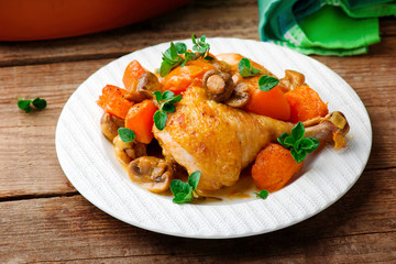 Chicken stewed with pumpkin and mushrooms.
