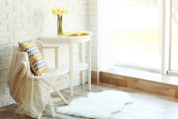 Beautiful narcissus on white wooden table
