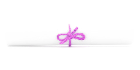 White letter roll tied with string, one pink knot isolated