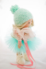 Textile doll with natural blonde hair