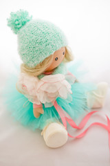 Textile doll with natural blonde hair