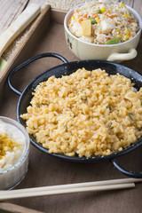 Different rice dishes (paella with vegetables, tomato and rice p
