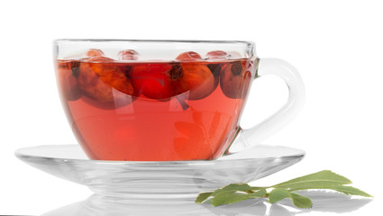 Transparent cup with tea and rose hips isolated on white 