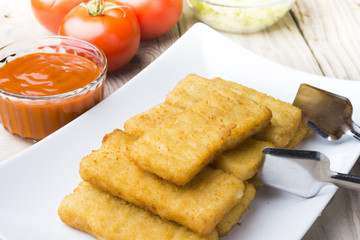 Meat croquettes served with fresh vegetables.
