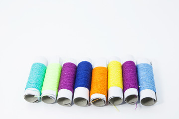 group of spools of thread on white background