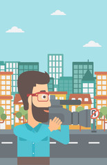 Cameraman with video camera.