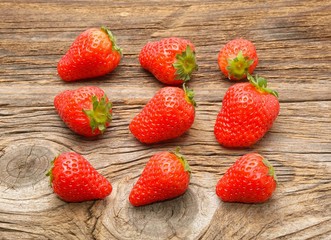 fresh strawberries on the brown wooden table